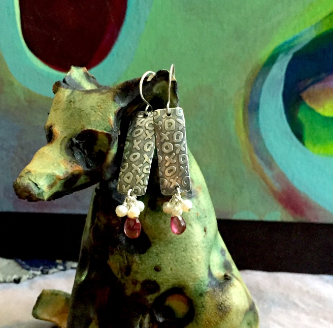 Wolf-dog by Shannon Bueker. Earrings are etched sterling with pearls and garnets